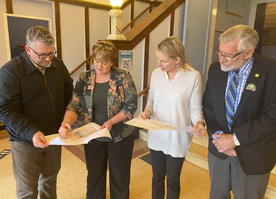 BIG PLANS: Leeton Shire Council's general manager Jackie Kruger shows federal water minister Keith Pitt (left), Member for Farrer Sussan Ley (second from right) the plans for the Roxy as Leeton mayor Paul Maytom watches on. PHOTO: Lizzie Gracie