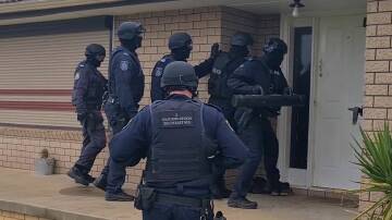 Strike Force Yatama detectives were supported by specialist teams executing search warrants in Leeton on Thursday. PHOTO: NSW Police