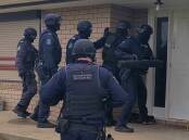 Strike Force Yatama detectives were supported by specialist teams executing search warrants in Leeton on Thursday. PHOTO: NSW Police