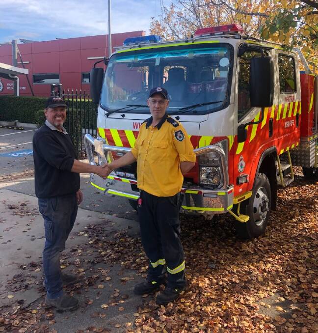 BRAND NEW: Whitton RFS captain Craig Kefford takes delivery of a new category seven dual cab fire truck from MIA District's David Sproule. Whitton's old truck will be rotated onto another brigade in the district. PHOTO: Contributed