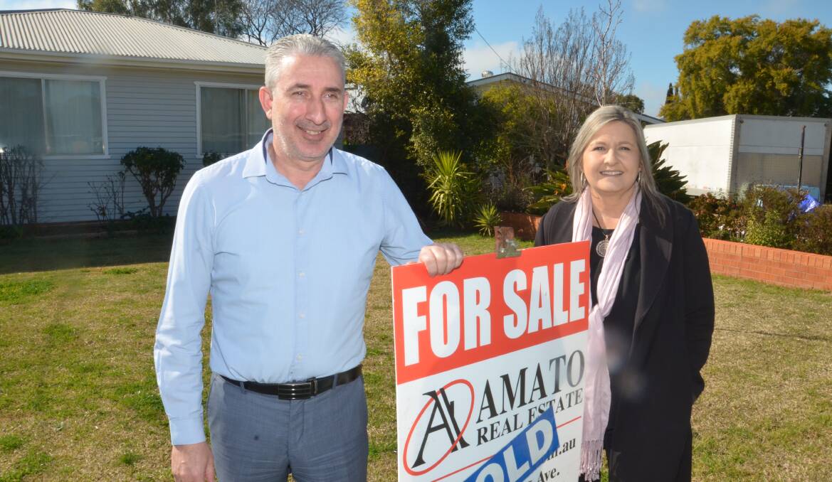 SOLD: Amato Real Estate principal Gino Amato and sales consultant Julie Valenzisi say there's still strong demand for Leeton real estate. PHOTO: Declan Rurenga
