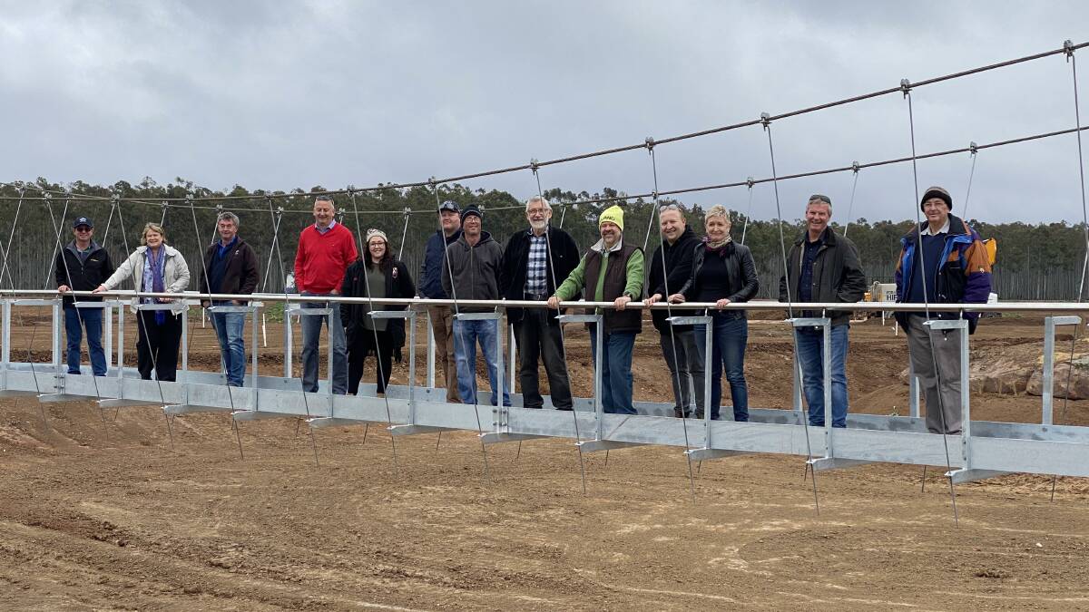 SUPPORT: Leeton Shire Councllors and Whitton Matl House representatives standing on the bridge over what will become a lake. PHOTO: Supplied