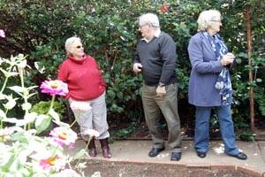 LEETON Water Wheel Garden Club president Joy Young (left) shows Max and Beth Allen from Coolamon around Tony and Sue Ciaverella's garden on Easter Monday.