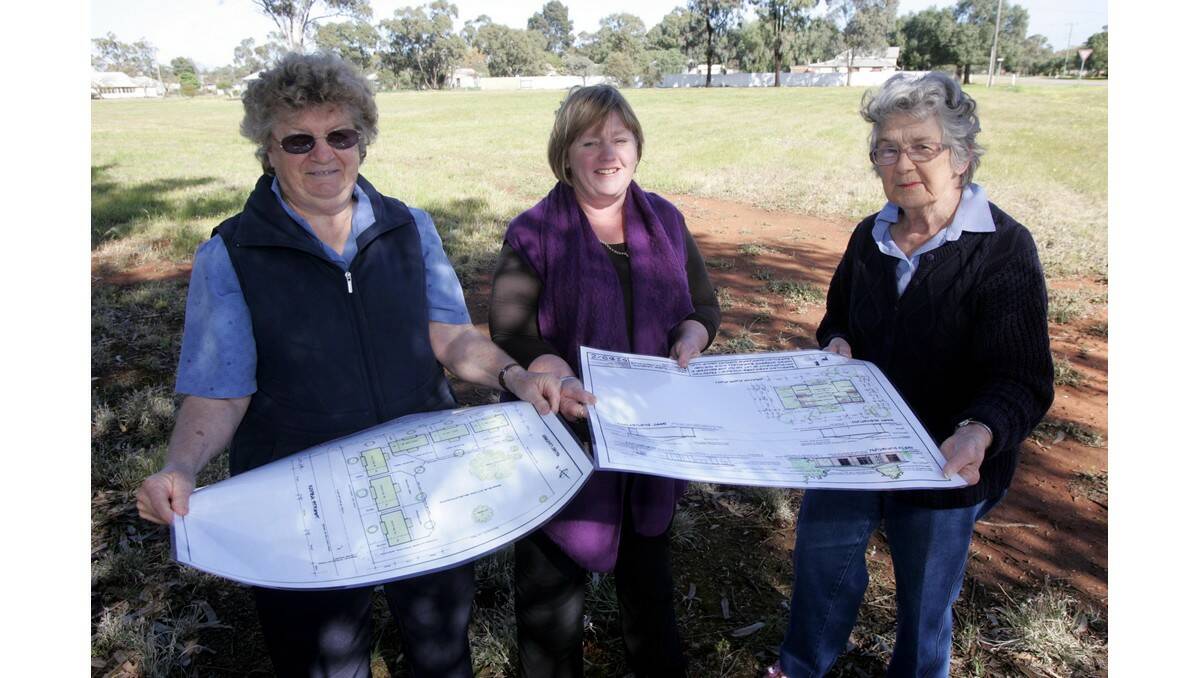 BARELLAN Aged Care Support Group members (from left) secretary Sandra Vicary, treasurer Colleen O'Grady and committee member Val Hawker look over plans for the aged-care units project at the block where they are to be built.