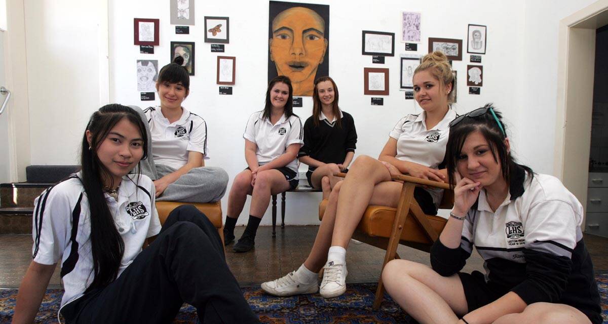 LEETON High School year 10 art students (seated from left) Paige Bills, Alice Middleton, Sheridan Simpson, Emily Clark, (front) Vanisa Tabal and Shannon Walsh have work on display at the Roxy Theatre art space.