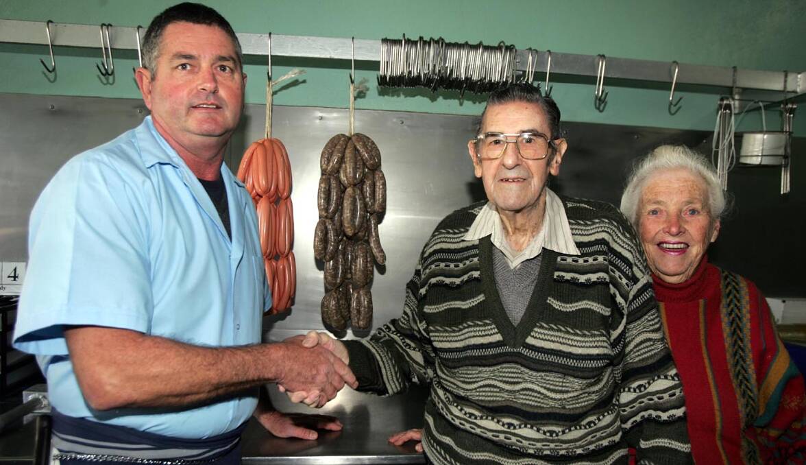 NEW owner Peter Heaslip (left) thanks Allen Martyn and wife Norma for more than 50 years of service at the butchery in Parkview.