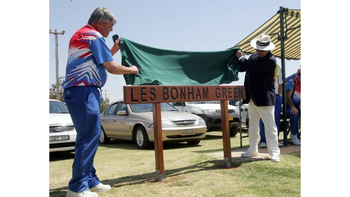 THE new sign naming the green after Les Bonham is unveiled by the man himself (left) and Riverina District Bowling Association president Jim Ovens.