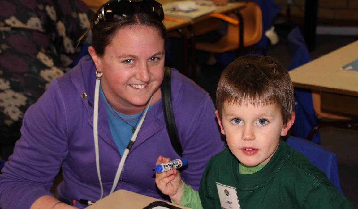 PARENT Steph Baylis shares time with son Jason Clough, 4, during the first day of Parkview's Kinder 2014 Transition program.