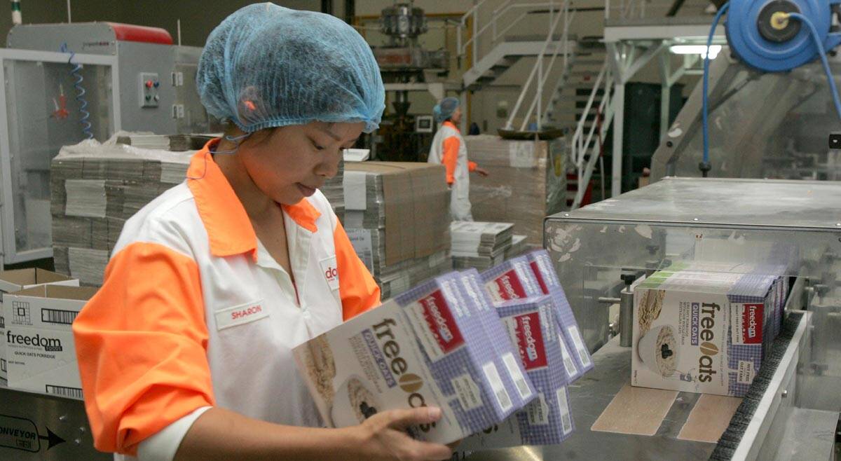 OPERATIONS at Freedom Foods are booming, with packer Angelina Lin one of 76 employees at the factory.
