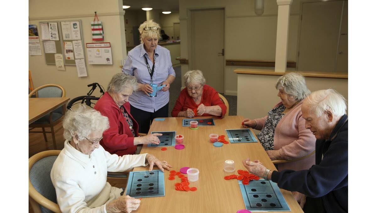 ACTIVITY officer at Alf Herrmann Lodge Marie Sibraa (back) leads residents (from left) Jess Morrell, June Macauley, Shirley Marsden, Dorothy Reeves and Archie Keoller in a game of bingo.