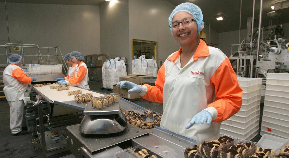 FREEDOM Foods packer Simi Kaur works on the biscuit line at the Stanbridge plant.
