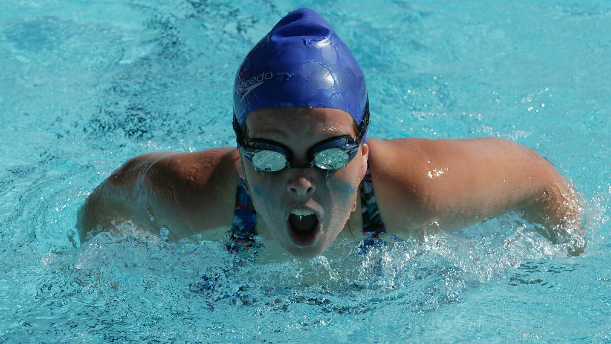 April Irvin in a butterfly race at the Leeton High School swimming carnival. 
