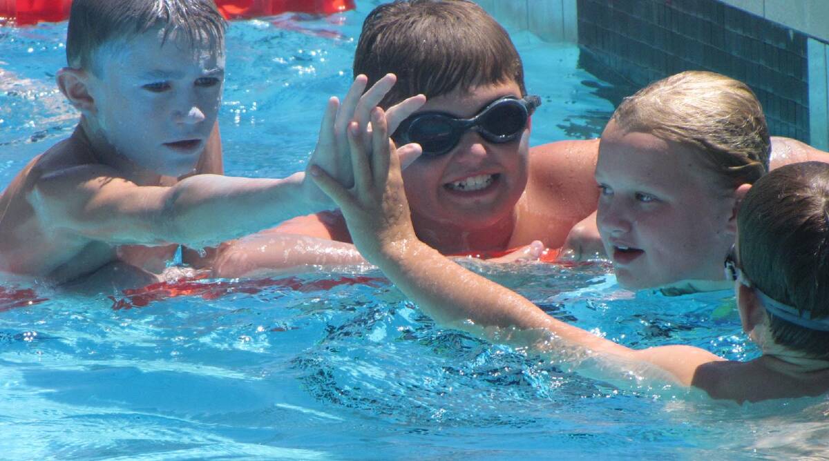 Mathew Axtill, 11 (Thorpe) and Jack Quinlivan, 10 (Freeman) congratulate each other after a tightly contested Senior Boys Relay at the Parkview PS Carnival held last Friday at the Leeton Pool.